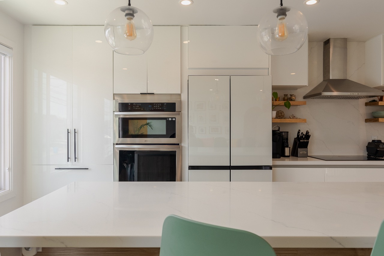 Kitchen with stainless steel double ovens in San Francisco full-house remodel