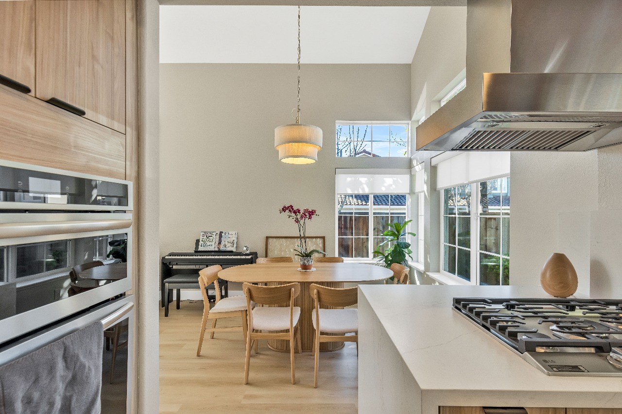 Kitchen and dining area with pendant light in Alameda full-house remodel