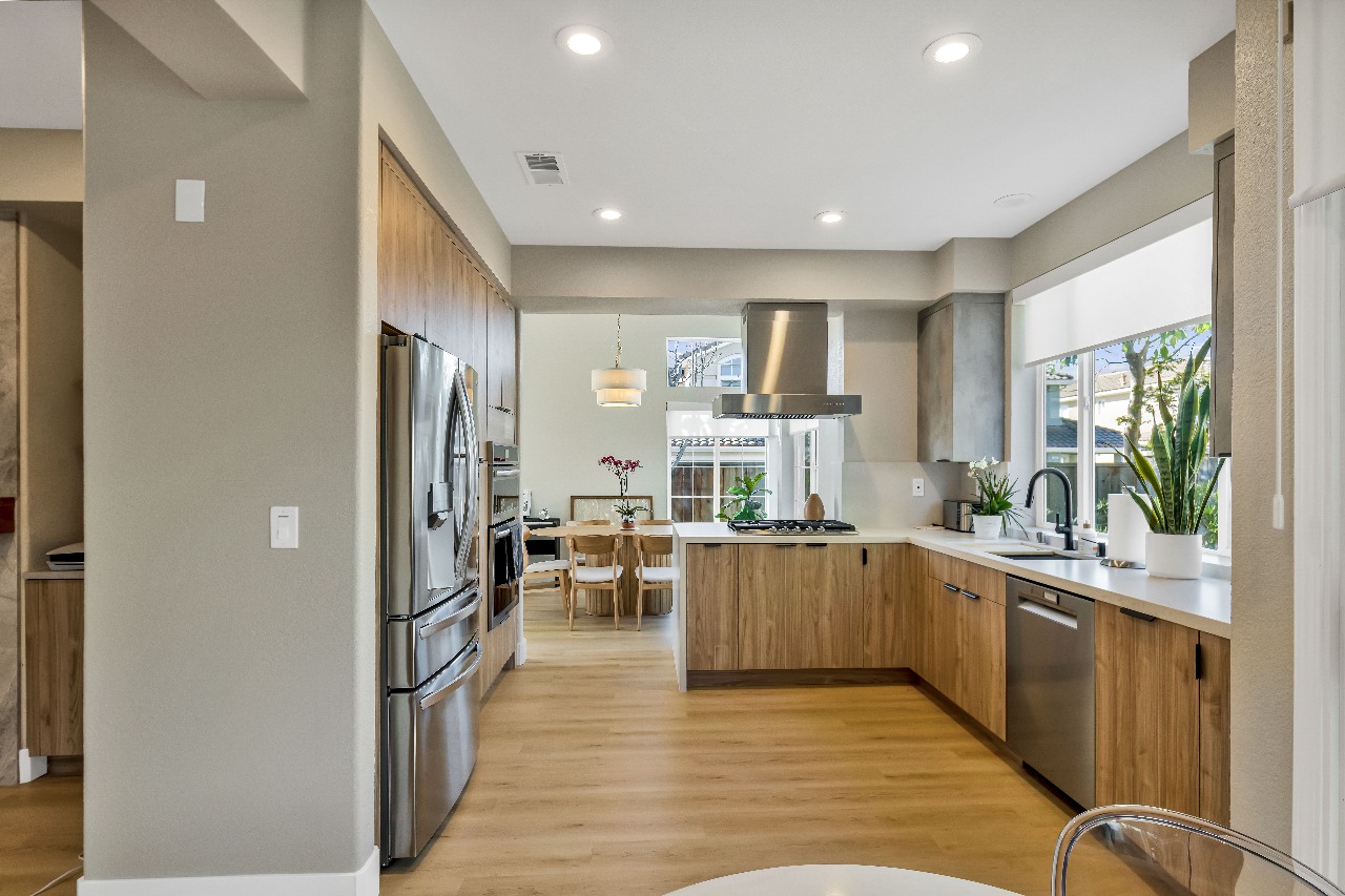 Kitchen with wood cabinets and stainless appliances in Alameda full-house remodel