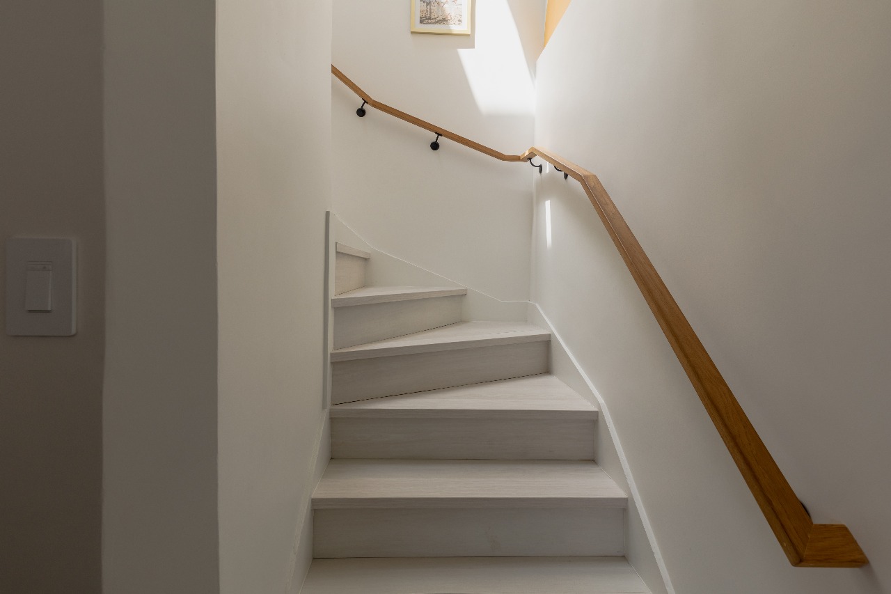 Staircase with wood handrail in San Francisco full-house remodel